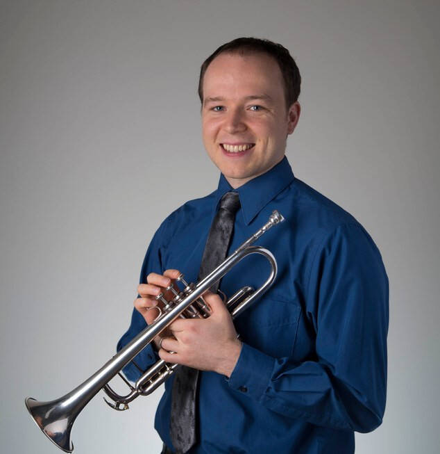 alex wilson holding trumpet